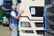 © Serhii - Truck driver inspecting semi truck before shipping