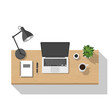 © Nashiir - Top View of Modern Workspace with Laptop, Coffee, Plant, and Lamp on a Wooden Desk, Isolated White Background