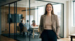 © Kaluya Stock - Happy businesswoman in a blazer smiles in a modern office with colleagues have a meeting in a conference room