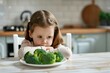 © Tanat - Funny Little Girl Refusing to Eat Broccoli Vegetables