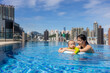 © leungchopan - Parent enjoying swimming time with baby at pool