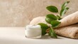 © Evgeniia - Clean beauty and skincare background with cream jar, towel and green leaves. Perfect for cosmetic brands, dermatology blogs and spa promotion.