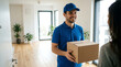 © alfrian sutria - Friendly Delivery Driver Handing Box to Customer at Apartment Door
