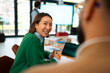© Artcore Studio/Stocksy - Smiling at work meeting