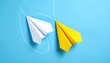© Qaisar  - Two paper airplanes, one white and one yellow, connected by a white line on blue background, symbolizing change in direction and innovation.