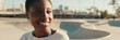 © Andrii Nekrasov - Close-up of a girl sitting in a skatepark in the summertime. Panoramic. Panoramic