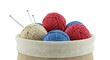 © arles - Yarn balls and knitting needles in a basket