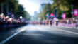 © Moddy - A blurred photograph of marathon runners racing down a city street, full of energy and dedication. People are blurred in the distance.