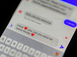 © frank - romance fraud concept on a smartphone