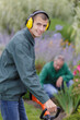 © auremar - close up of a smiling young man gardener