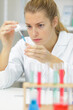 © auremar - woman working with pipettes in a lab