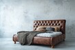 © YOUR - Richly upholstered antique style bed rests against a stark, textured wall