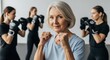 © Running opossum - elderly woman confidently boxing with young women in a fitness class setting