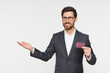 © InsideCreativeHouse - Hand, credit card and portrait of man in studio with happy financial freedom and security savings. Happiness, businessman with banking and saving by investing in small business startup budget