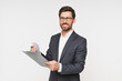 © InsideCreativeHouse - Confident young businessman in formal wear with clipboard isolated over white background. Manager engineer checking quality, doing check-list, paperwork, loan and documents