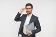 © InsideCreativeHouse - Confident employee business man corporate lawyer wears classic formal suit shirt hold clipboard with paper account documents, finance deal, insurance contract isolated on white background studio