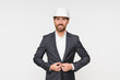 © InsideCreativeHouse - Architecture, engineering and portrait of man in studio standing with success, confidence leadership. Creative, construction and happy male contractor with safety gear helmet isolated white background