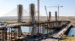 © Abu - Massive Bridge Pylons Under Construction with Scaffolding Over Water