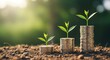 © Turzo Khan - Coins stacked with green seedlings growing symbolizing financial growth and investment