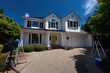 © Mselected - Workers prepare for home maintenance at a suburban house in daylight
