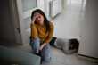 © Zoran Jesic - Stressed mother dealing with child tantrum on floor