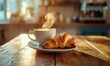 © Sergey - Delicious croissant with a steaming cup of espresso on a rustic wooden table, warm tones and soft lighting emphasizing a cozy breakfast moment