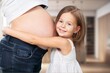 © BillionPhotos.com - Happy child holding belly of the pregnant mother