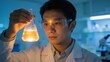 © Bruce - Scientist examining liquid in flask