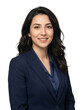 © LoveDe Studio - Professional young woman in a dark blue suit smiling confidently, studio portrait against a white background.