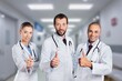 © BillionPhotos.com - Portrait of a happy successful team of doctors in uniform