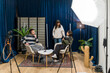 © unai - Young adults recording a podcast interview in media studio