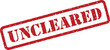 © designboundary - Distinctive red rectangular stamp presenting the word UNCLEARED on a bright white surface