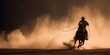 © Vera D - Cowboy riding horse through desert dust at sunset, western lifestyle action scene