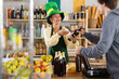 © JackF - St Patrick Day in Ireland - female vendor offers Irish ale to male customer