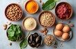 © miss irine - Assorted nutrient rich foods in bowls. Spinach almonds pine nuts white beans oysters eggs and grains. Healthy diet concept preparation for meal.