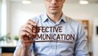 © Design Store - Businessman writing 'effective communication' on glass, concept of clear dialogue and understanding in business, teamwork and professional relationship building