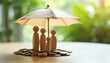 © Vadym - Wooden figures of family stand on pile of coins under umbrella. Concept of money safety, financial security, and savings protection for household.