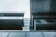 © yaqui_villegas - Minimal steel and glass architecture with strong overhang and precise structural lines creating modern geometric order for abstract background