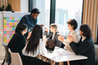 © chokniti - Business team showing unity success with hands together in office, teamwork collaboration and power motivation, diverse colleagues celebrating achievement corporate goal partnership
