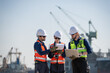 © surachetkhamsuk - Professional engineering working at shipyard, Professional logistics monitoring cargo operations at industrial shipyard.
