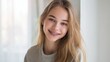 © Babb - Smiling caucasian teen girl with braces and long blonde hair