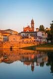 Famous Roman Bridge and historic center of Rimini, Italy at sunset