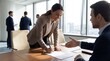 © JohnLester - Professional businesswoman signing contract agreement in modern office meeting with male colleague. Corporate partnership deal. Success negotiation business handshake