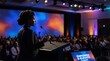 © Tin - Silhouette of African American woman speaking at business dais concept. A speaker inspiring an audience at a professional conference event.