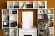 © Pixel-Shot - Young woman taking book from bookshelf in stylish home library