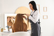 © Pixel-Shot - Female hairdresser working with client in beauty salon