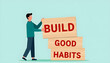 © ali - Build good habits concept with a man arranging wooden blocks with the text build good habits