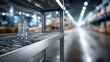 © Dmitry - A water bottle sits alone on a metal shelf within a warehouse, indicating a break or pause in work