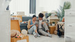 © tirachard - Young happy Asia couple sit on sofa couch use digital tablet online shopping furniture from decoration store in living room at home. Husband wife move new house, Apartment Rent And Ownership Concept.