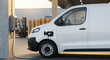 © Chdesignme - Commercial white van electric car charging at a logistics warehouse